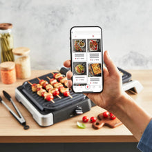 Carica l'immagine nel visualizzatore di Gallery, Tefal OptiGrill GC776D10 - Griglia a contatto 4 in 1 con vassoio, apribile, 9 programmi, indicatore del livello di cottura, griglia elettrica, forno, in acciaio inox/nero